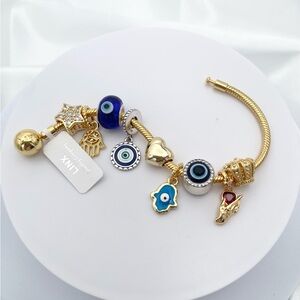 Linx Yellow Gold Snake Chain Bracelet with Hamsa and Evil Eye Themed Charms